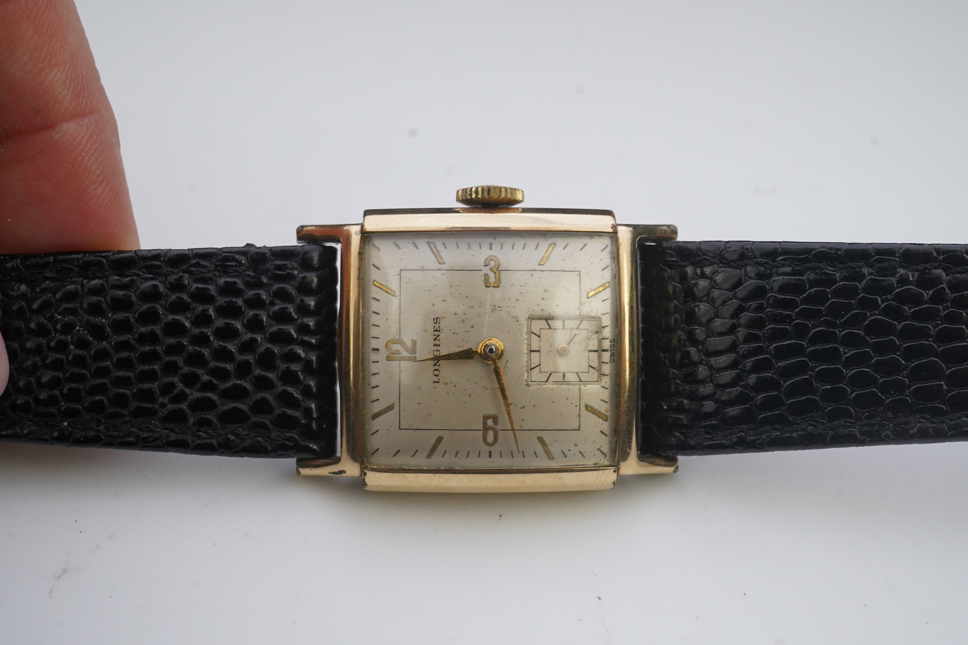 A gentleman's late 1940's gold plated Longines manual wind wrist watch, on a later associated leather strap